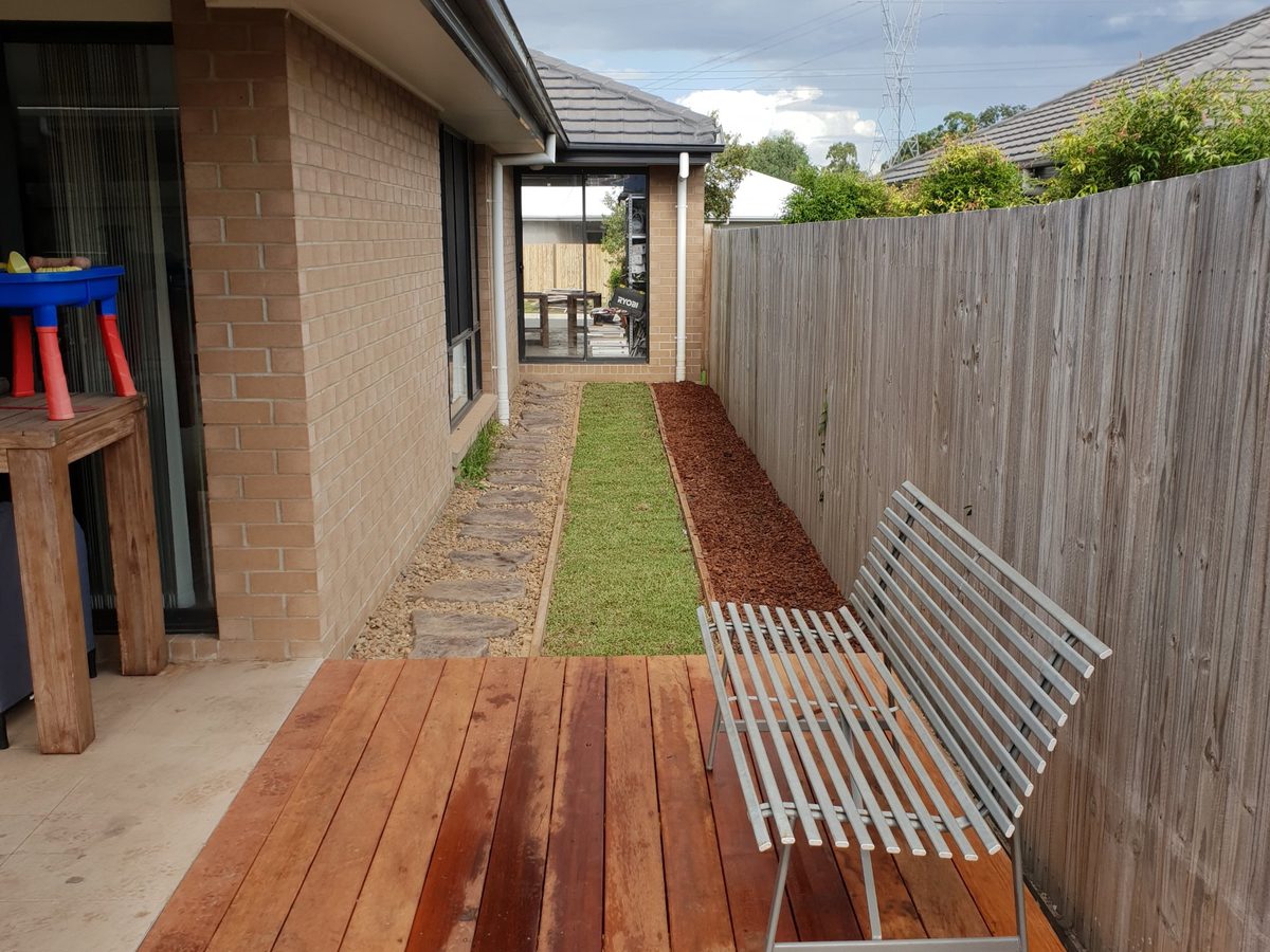 Hardwood deck with turf and garden bed